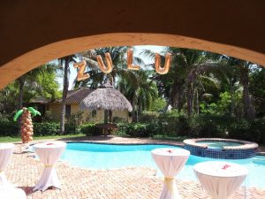Balloon Palm Tree Column with over the pool balloon Letters Arch