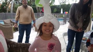 Happy Girl With a Balloon Hat