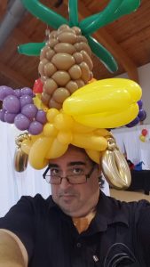 The Miami Balloon Guy with a Carmen Miranda Styles Balloon Hat