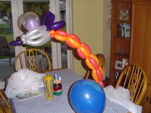 Alien ship flying over the earth balloon centerpiece