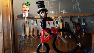 Abraham Lincoln on a bike for Lincolns Beard Brewery