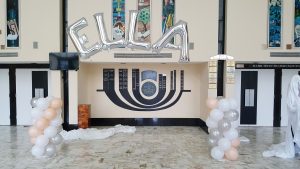 Balloon decorations with columns and giant letter balloons