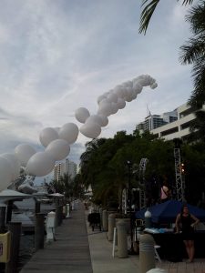 Beginning of the balloon garland into the sky with lights
