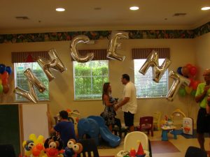 Big balloon letters with bouquet at Sesame Street themed party