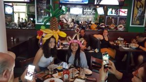 crazy balloon hats in a restaurant
