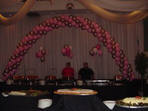 Giant helium filled balloon arch and bouquets