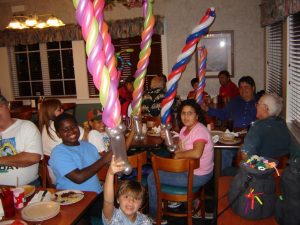 Happy kids with crazy sword balloons