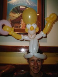Homer Simpson parody balloon hat.
