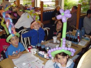 Kids with balloon hats