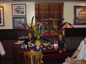 Kids with balloon jester hats