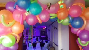 Neon balloon arch lit up