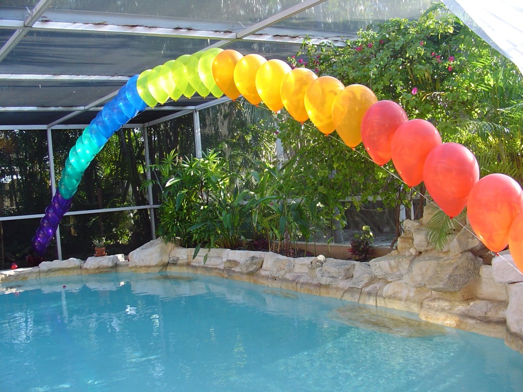 Rainbow colored string of pearls balloon arch for a pride party