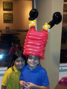 Santa stuck in a chimney balloon hat