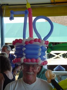 Seventieth birthday balloon cake hat