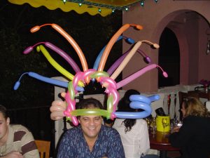 Silly balloon hat at restaurant
