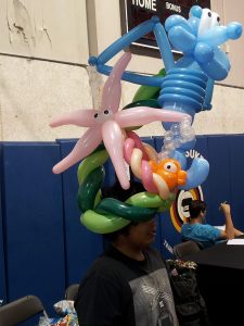 Under the sea balloon hat with a seahorse and starfish at the Miccosukkee annual health fair